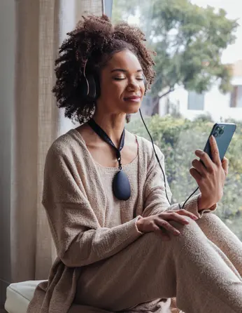 Woman with headphones on looking calmn